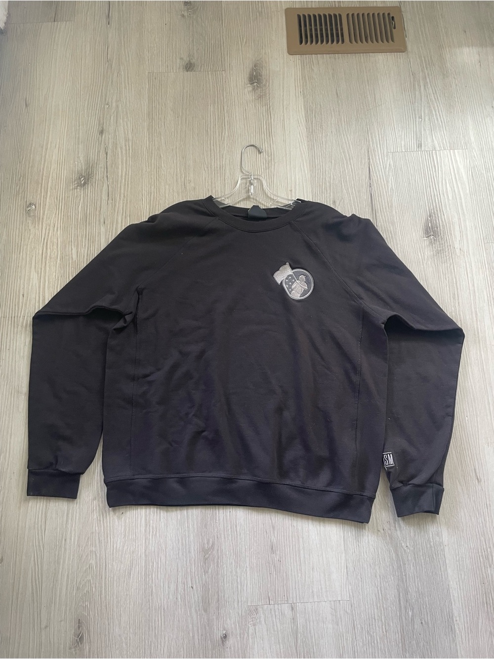 Men's Black Crewneck Sweatshirt with Subtle Chest Emblem
